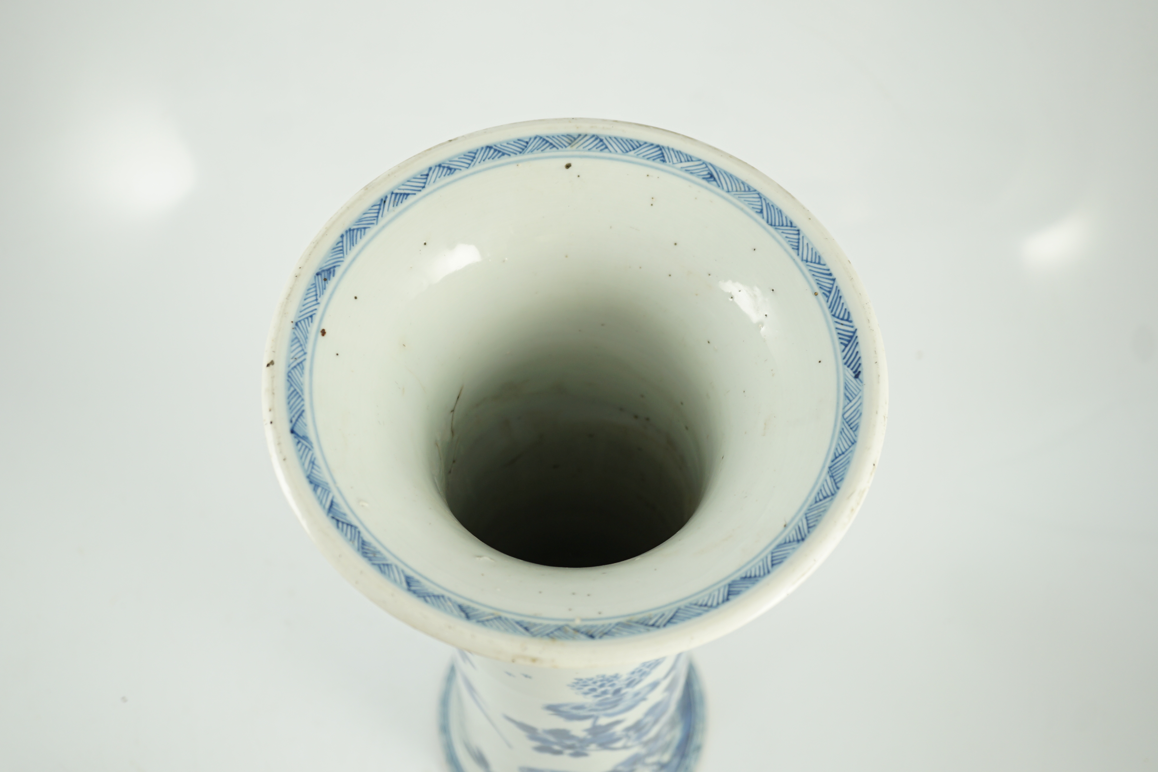 A tall Chinese blue and white ‘pheasants and rocks’ beaker vase, gu, Kangxi period, minor faults